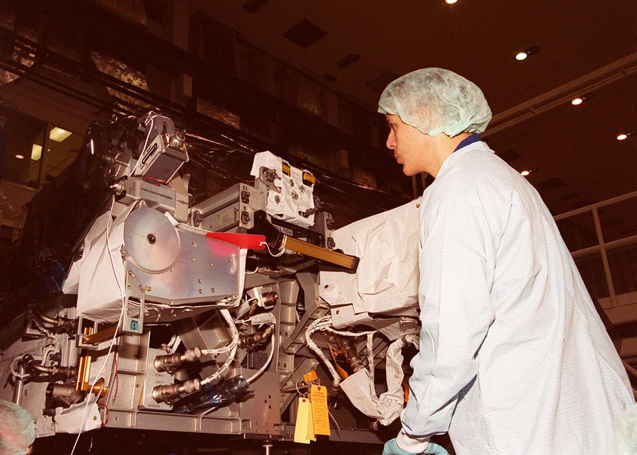 KENNEDY SPACE CENTER, Fla. -- In the Operations and Checkout Building, STS-110 Mission Specialist Lee M. Morin checks out Integrated Truss Structure (ITS) S0, which will be part of the payload on the mission. He and other crew members are at KSC for a Crew Equipment Interface Test. The STS-110 crew comprises Commander Michael J. Bloomfield, Pilot Stephen N. Frick, Mission Specialists Jerry L. Ross , Steven L. Smith, Ellen Ochoa, Morin and Rex J. Walheim. The ITS S0 is part of the payload on the mission. It is the center segment they will be installing on the International Space Station, part of the 300-foot (91-meter) truss attached to the U.S. Lab. By assembly completion, four more truss segments will attach to either side of the S0 truss. STS-110 is currently scheduled to launch in February 2002
