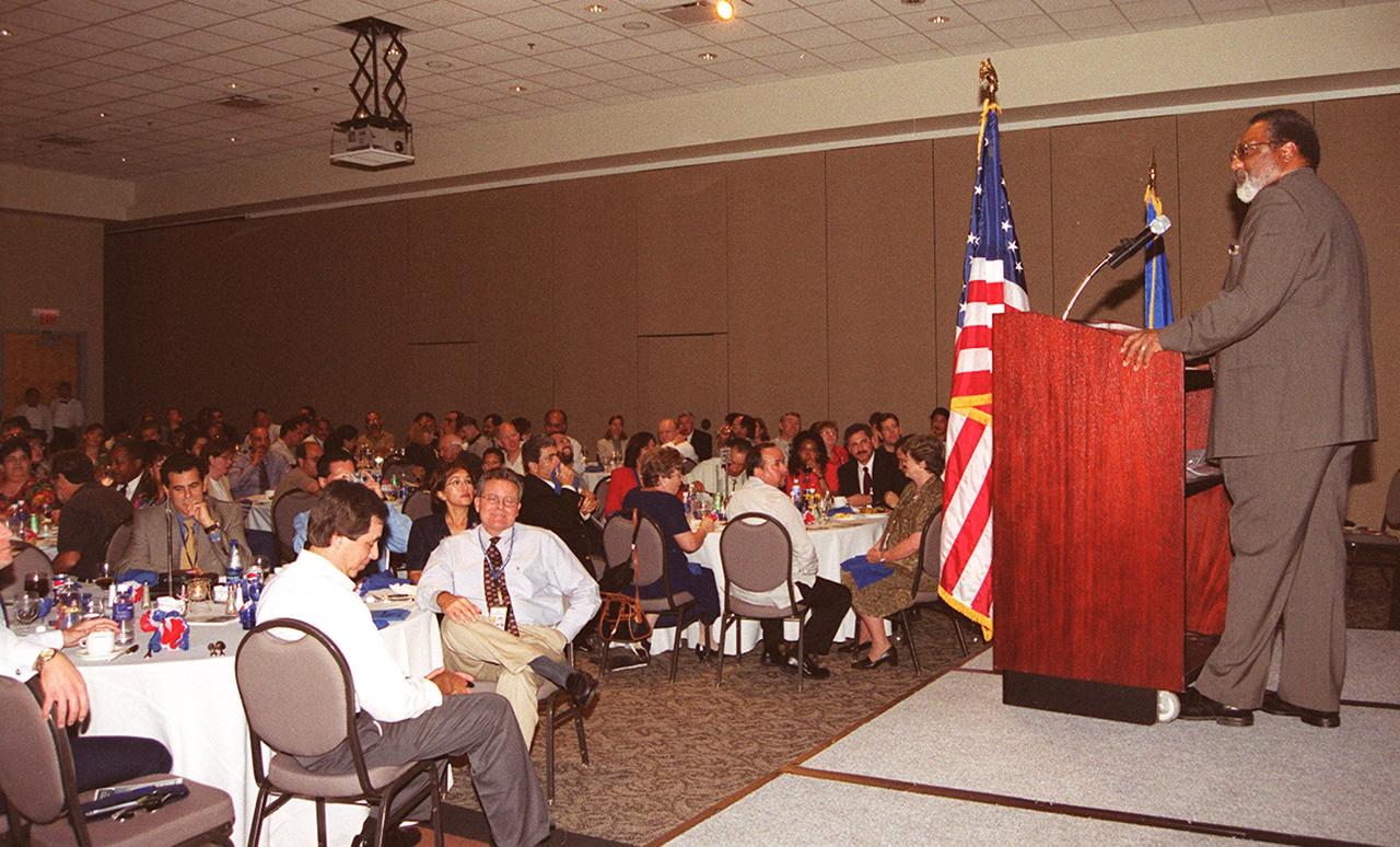 KENNEDY SPACE CENTER, Fla. --   Deputy Center Director Jim Jennings speaks to guests at the annual Hispanic Heritage  Month Celebration, held at the Kurt Debus Conference Facility at KSC.  Chaired by Rey N. Diaz and Maria Lopez-Tellado, who received plaques of appreciation for their efforts, the event also featured a luncheon and comments by Miguel Rodriquez, chief, Integration Office, of the Joint Performance Management Office.  The pledge of allegiance and invocation was led by Joseph Tellado, International Space Station_Payload Processing.  The Merrit Island High School ROTC provided the color guard.  The event was sponsored by the Hispanic Employment Program Working Group at KSC