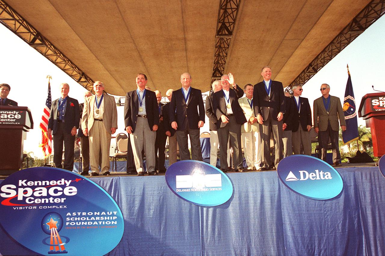 KENNEDY SPACE CENTER, Fla. --  The outdoor stage at the KSC Visitor Complex is filled with members of the Astronaut Hall of Fame who gathered to honor the four standing in the front center: Robert Crippen (second from left), Frederick 'Rick' Hauck, Richard Truly and Joe Engle.  These first Shuttle astronauts were the 2001 inductees. 