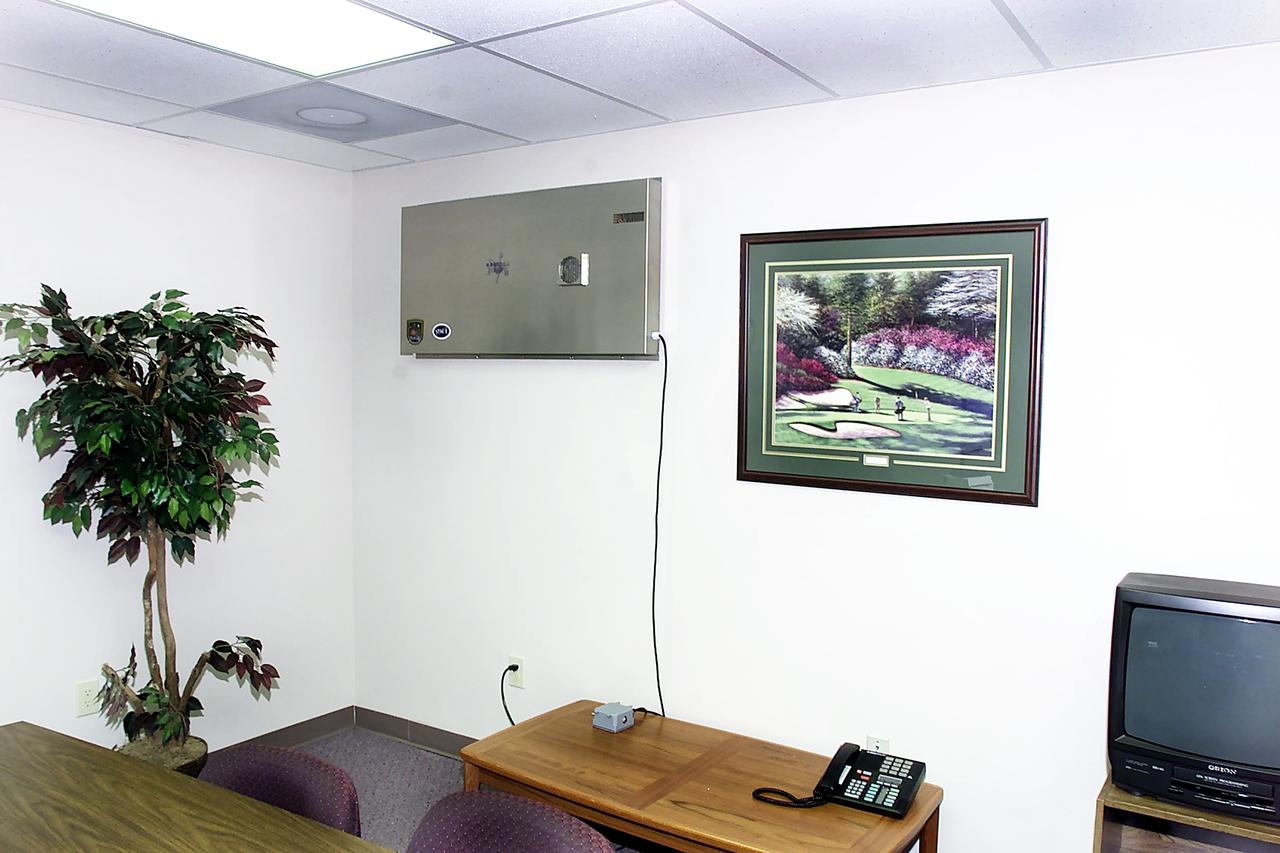 AiroCide Ti02, an anthrax-killing air scrubber manufactured by KES Science and Technology Inc., in Kernesaw, Georgia, looks like a square metal box when it is installed on an office wall. Its fans draw in airborne spores and airflow forces them through a maze of tubes. Inside, hydroxyl radicals (OH-) attack and kill pathogens. Most remaining spores are destroyed by high-energy ultraviolet photons. Building miniature greenhouses for experiments on the International Space Station (ISS) has led to the invention of this device that annihilates anthrax-a bacteria that can be deadly when inhaled. The research enabling the invention started at the University of Wisconsin (Madison) Center for Space Automation and Robotics (WCSAR), one of 17 NASA Commercial Space Centers. A special coating technology used in the anthrax-killing invention is also being used inside WCSAR-built plant growth units on the ISS. This commercial research is managed by the Space Product Development Program at the Marshall Space Flight Center.