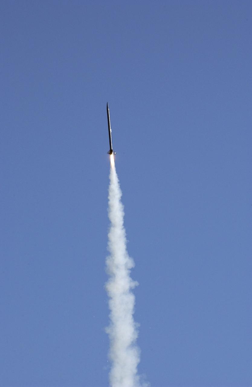 Filled with anticipation, students from two local universities, the University of Alabama in Huntsville (UAH), and Alabama Agricultural Mechanical University (AM), counted down to launch the rockets they designed and built at the Army test site on Redstone Arsenal in Huntsville, Alabama. The projected two-mile high launch culminated more than a year's work and demonstrated the student team's ability to meet the challenge set by the Marshall Space Flight Center's (MSFC) Student Launch Initiative (SLI) program to apply science and math to experience, judgment, and common sense, and proved to NASA officials that they have successfully built reusable launch vehicles (RLVs), another challenge set by NASA's SLI program. MSFC's SLI program is an educational effort that aims to motivate students to pursue careers in science, math, and engineering. It provides the students with hands-on, practical aerospace experience. In this picture, the combined efforts of students from UAH and AM sent this rocket soaring into flight. Students at UAH built the rocket and AM students developed its scientific payload, an experiment that measures the amount of hydrogen produced during electroplating with nickel in a brief period of micrgravity.