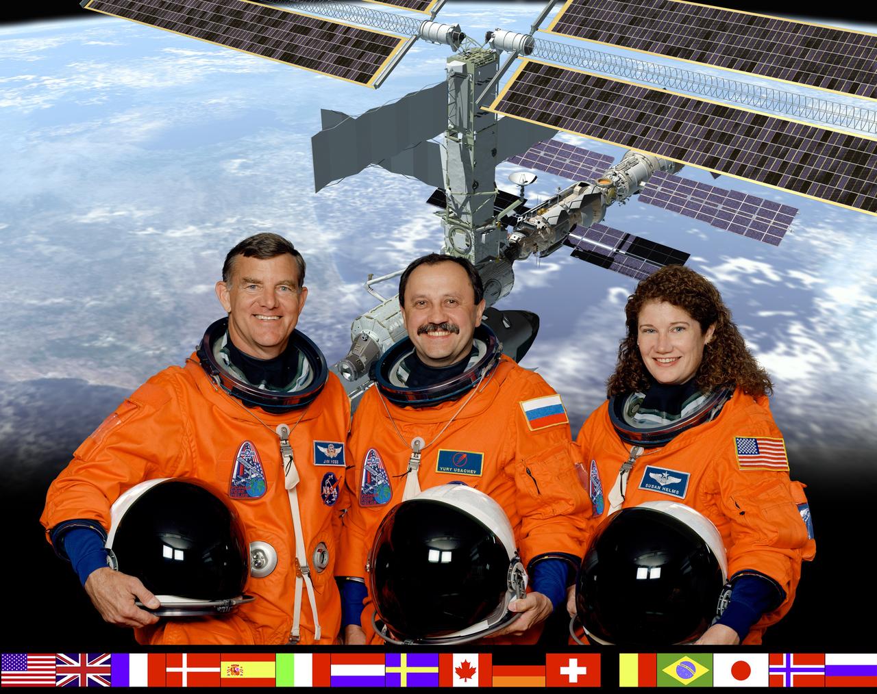 This is a crew portrait of the International Space Station (ISS) Expedition Two. Left to right are Astronaut James S. Voss, flight engineer; Cosmonaut Yury V. Usachev, commander; and Astronaut Susan J. Helms, flight engineer. The crew was launched on March 8, 2001 aboard the STS-102 mission Space Shuttle Orbiter Discovery for an extended stay on the ISS. After living and working on the ISS for the duration of 165 days, the crew returned to Earth on August 22, 2001 aboard the STS-105 mission Space Shuttle Orbiter Discovery. Cosmonaut Usachev represents the Russian Aviation and Space Agency. The flags representing all the international partners are arrayed at bottom.