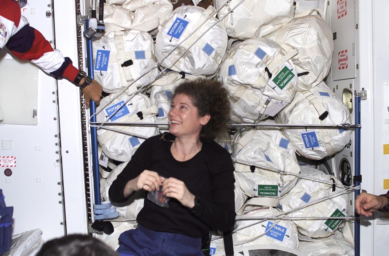 In this photograph, Astronaut Susan Helms, Expedition Two flight engineer, is positioned near a large amount of water temporarily stored in the Unity Node aboard the International Space Station (ISS). Astronaut Helms accompanied the STS-105 crew back to Earth after having spent five months with two crewmates aboard the ISS. The 11th ISS assembly flight, the Space Shuttle Orbiter Discovery STS-105 mission was launched on August 10, 2001, and landed on August 22, 2001 at the Kennedy Space Center after the completion of the successful 12-day mission.