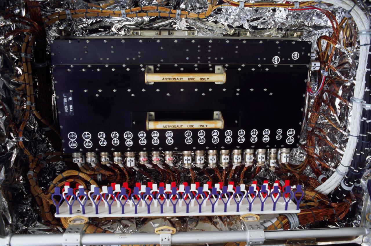 This is an onboard photo of the Hubble Space Telescope (HST) power control unit (PCU), the heart of the HST's power system. STS-109 payload commander John M. Grunsfeld, joined by Astronaut Richard M. Lirnehan, turned off the telescope in order to replace its PCU while participating in the third of five spacewalks dedicated to servicing and upgrading the HST. Other upgrades performed were: replacement of the solar array panels; replacement of the Faint Object Camera (FOC) with a new advanced camera for Surveys (ACS); and installation of the experimental cooling system for the Hubble's Near-Infrared Camera and Multi-Object Spectrometer (NICMOS), which had been dormant since January 1999 when its original coolant ran out. The telescope was captured and secured on a work stand in Columbia's payload bay using Columbia's robotic arm, where crew members completed the system upgrades. The Marshall Space Flight Center had the responsibility for the design, development, and construction of the HST, which is the most complex and sensitive optical telescope ever made, to study the cosmos from a low-Earth orbit. The HST detects objects 25 times fainter than the dimmest objects seen from Earth and provides astronomers with an observable universe 250 times larger than is visible from ground-based telescopes, perhaps as far away as 14 billion light-years. Launched March 1, 2002 the STS-109 HST servicing mission lasted 10 days, 22 hours, and 11 minutes. It was the 108th flight overall in NASA's Space Shuttle Program.