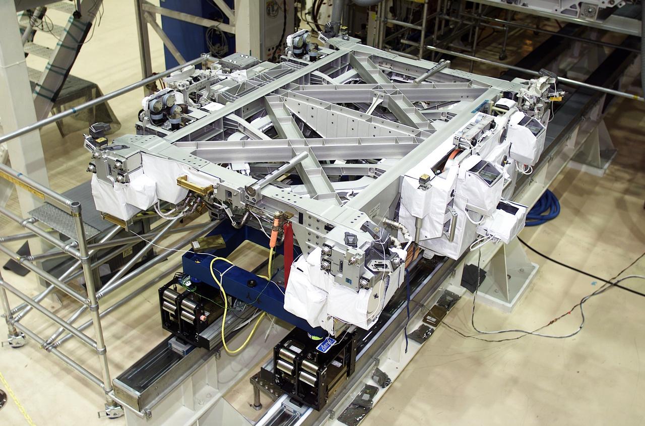 The Space Shuttle Atlantis, STS-110 mission, deployed this railcar, called the Mobile Transporter, and an initial 43-foot section of track, the S0 (S-zero) truss, preparing the International Space Station (ISS) for future spacewalks. The first railroad in space, the Mobile Transporter will allow the Station's robotic arm to travel up and down the finished truss for future assembly and maintenance. The 27,000-pound S0 truss is the first of 9 segments that will make up the Station's external framework that will eventually stretch 356 feet (109 meters), or approximately the length of a football field. The completed truss structure will hold solar arrays and radiators to provide power and cooling for additional international research laboratories from Japan and Europe that will be attached to the Station. The Space Shuttle Orbiter Atlantis, STS-110 mission, was launched April 8, 2002 and returned to Earth April 19, 2002. STS-110's Extravehicular Activity (EVA) marked the first use of the Station's robotic arm to maneuver spacewalkers around the Station.