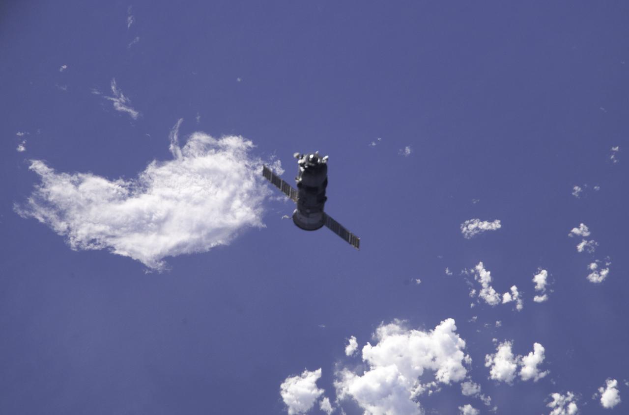 The unpiloted Russian Progress 7 supply ship departs from the Zvezda Service Module's docking port on the International Space Station. Carrying its load of trash and urneeded equipment, it will be deorbited and burned up in the atmosphere. The undocking paves the way for the arrival of the new Progress 8, filled with fresh supplies. Soviet designers realized that long-duration missions in space would demand a constant supply of consumable materials from Earth. The cost-effective Progress spacecraft made possible an almost permanent presence in space and stands out as a single biggest contribution to this achievement. Propulsion and service systems were installed in the tail section of the vehicle and the cargo ship was inseparable during its entire flight. Upon conclusion of its supply mission to the Station, it would be directed into the atmosphere to burn up.