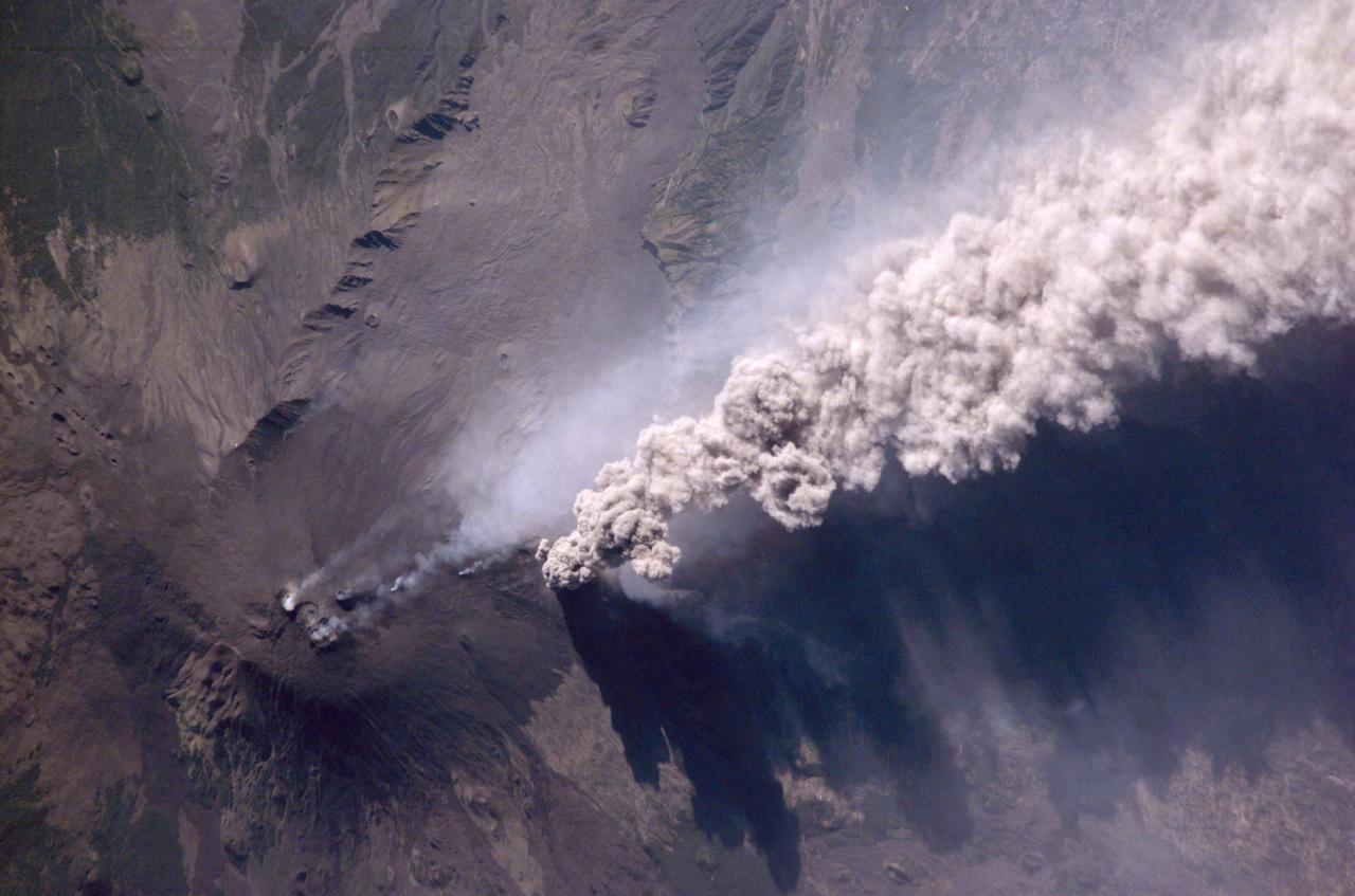 An Expedition Two crewmember aboard the International Space Station (ISS) captured this overhead look at the smoke and ash regurgitated from the erupting volcano Mt. Etna on the island of Sicily, Italy. At an elevation of 10,990 feet (3,350 m), the summit of the Mt. Etna volcano, one of the most active and most studied volcanoes in the world, has been active for a half-million years and has erupted hundreds of times in recorded history.