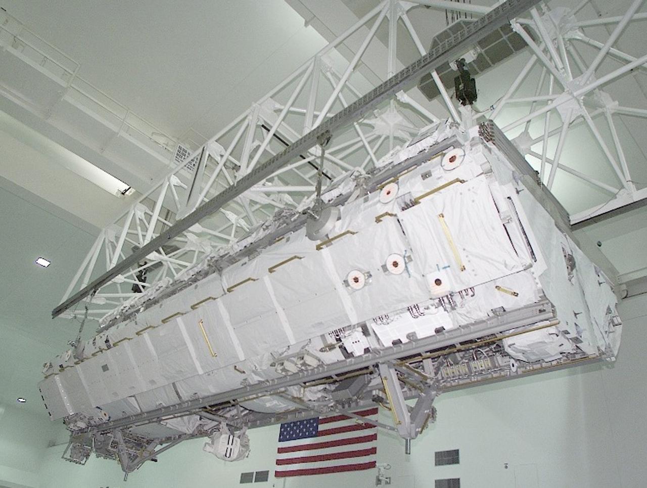 Shown here is the International Space Station (ISS) S1 Truss in preparation for installation in the payload bay of the Space Shuttle Atlantis at NASA's Kennedy Space Center )KSC)in Florida. The truss launched October 7, 2002 on the STS-112 mission and will be attached during three spacewalks. Constructed primarily of aluminum, it measures 45 feet long, 15 feet wide, 10 feet tall, and weighs over 27,000 pounds. It is one of nine similar truss segments that, combined, will serve as the Station's main backbone, measuring 356 feet from end to end upon completion. Manufactured by the Boeing Company in Huntington Beach, California, the truss was flown to the Marshall Space Flight Center, in Huntsville, Alabama where brackets, cable trays, fluid tubing, and other secondary components and outfitting items were added. In Huntsville, it was screened for manufacturing flaws, including pressure and leak checking tubing, and electrical checks for cabling, before being shipped to KSC for final hardware installation and testing. The Space Station's labs, living modules, solar arrays, heat radiators, and other main components will be attached to the truss.