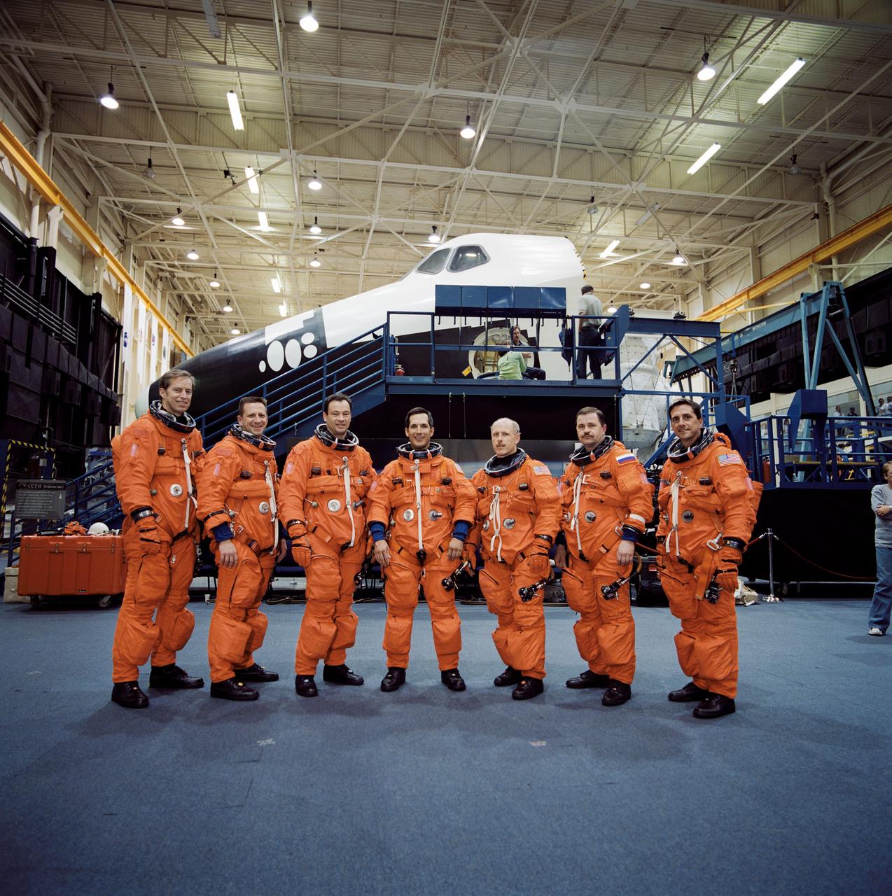 Pictured is the crew for the Shuttle Endeavor STS-113 mission snapped during a training session in the Space Vehicle Mockup Facility at the Johnson Space Center. From the left are Astronauts James D. Wetherbee, STS-113 mission commander; Christopher J. (Gus) Loria, pilot; Michael E. Lopez-Alegria and John B. Herrington, mission specialists; Kerneth D. Bowersox, Expedition Six mission commander; Cosmonaut Nikloai M. Budarin and astronaut Donald A. Thomas, Expedition Six Flight Engineers. The 16th American assembly flight and 112th overall American flight to the International Space Station (ISS), STS-113 mission objectives included the delivery of the Expedition Six Crew to the ISS, the return of Expedition Five back to Earth, and the installation and activation of the Port 1 Integrated Truss Assembly (P1). The first major component installed on the left side of the Station, the P1 truss provides an additional three External Thermal Control System radiators. Weighing in at 27,506 pounds, the P1 truss is 45 feet (13.7 meters) long, 15 feet (4.6 meters) wide, and 13 feet (4 meters) high. Three space walks, aided by the use of the Robotic Manipulator Systems of both the Shuttle and the Station, were performed in the installation of P1. Also, more than 2,500 pounds (1,134 kilograms) of cargo were transferred between the Shuttle and Station. The Space Shuttle Orbiter Endeavor launched on November 23, 2002 from Kennedy's launch pad 39A and returned 11 days later on December 4, 2002.