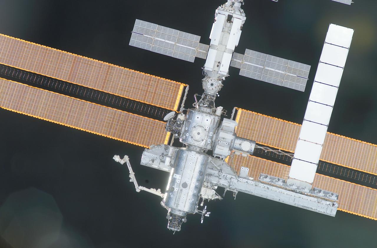 Back dropped against the blackness of space, the International Space Station (ISS) sporting its new S-1 Truss (lower right) and cooling radiator (white portion to the right of frame) is captured on film by the STS-113 crew as the Space Shuttle Orbiter Endeavor approaches the International Space Station (ISS). STS-112 mission installed the S1 truss in October 2000. It is one of nine similar truss segments that, combined, will serve as the Station's main backbone, measuring 356 feet from end to end upon completion. The Space Station's labs, living modules, solar arrays, heat radiators, and other main components will be attached to the truss. The 16th American assembly flight and 112th overall American flight to the ISS launched on November 23, 2002 from Kennedy's launch pad 39A aboard the Space Shuttle Orbiter Endeavor STS-113. The main mission objective was to install and activate the Port 1 Integrated Truss Assembly (P1) to the left side of the station.