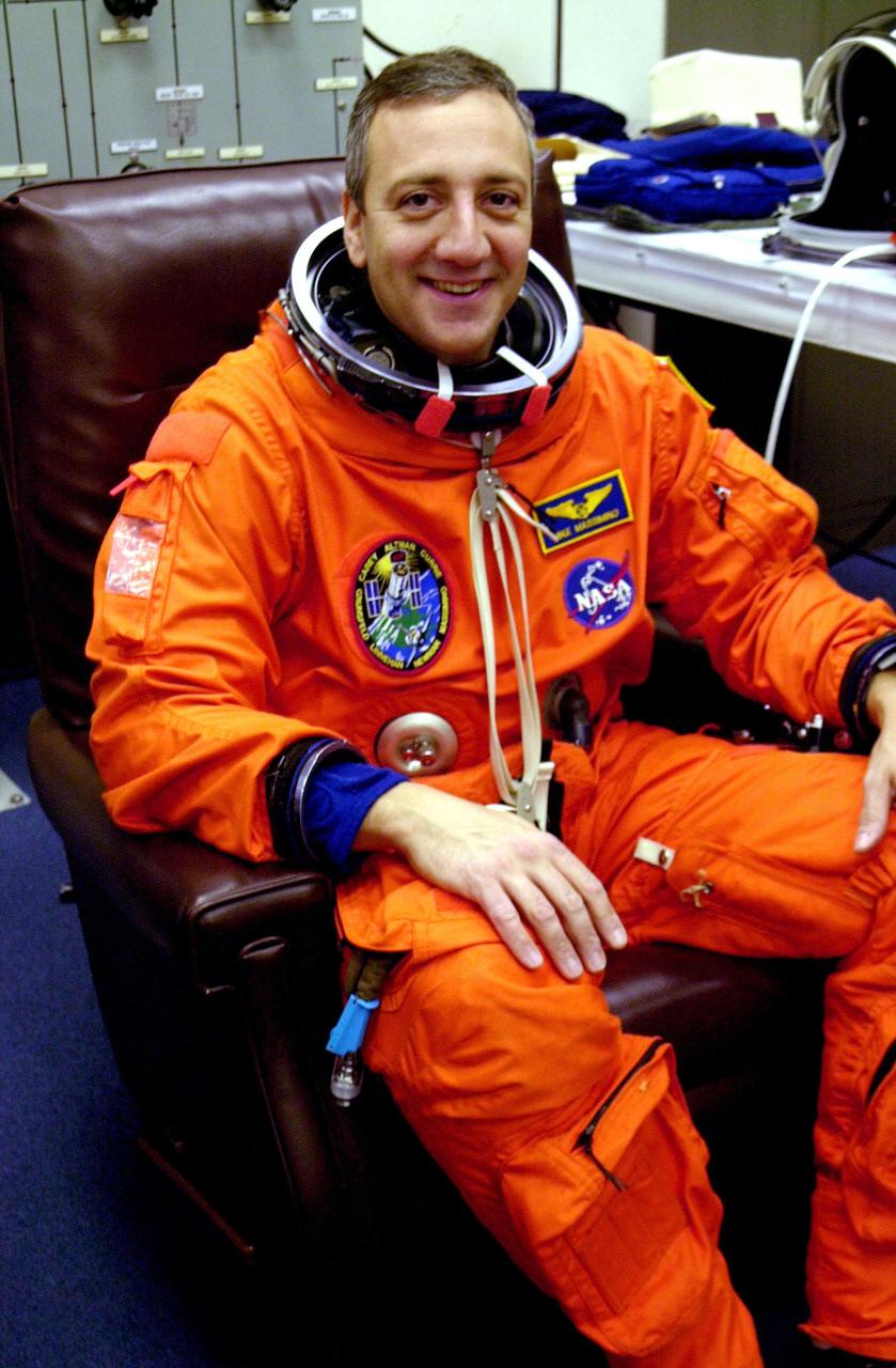KENNEDY SPACE CENTER, FLA. -- STS-109 Mission Specialist Michael Massimino relaxes during a suit check, part of Terminal Countdown Demonstration Test activities.   He and other crew members - Commander Scott Altman, Pilot Duane Carey, Payload Commander John Grunsfeld and Mission Specialists Nancy Currie, James Newman and Richard Linnehan - are at Kennedy for the TCDT that also includes emergency egress training and a simulated countdown.  Columbia is scheduled to be launched Feb. 28 on mission STS-109, a Hubble Servicing Mission. The goal of the mission is to replace Solar Array 2 with Solar Array 3, replace the Power Control Unit, remove the Faint Object Camera and install the ACS, install the Near Infrared Camera and Multi-Object Spectrometer (NICMOS) Cooling System, and install New Outer Blanket Layer insulation.  The launch will be the first for Columbia after returning from California where it underwent extensive maintenance, inspections and enhancements. More than 100 upgrades make Columbia safer and more reliable than ever before