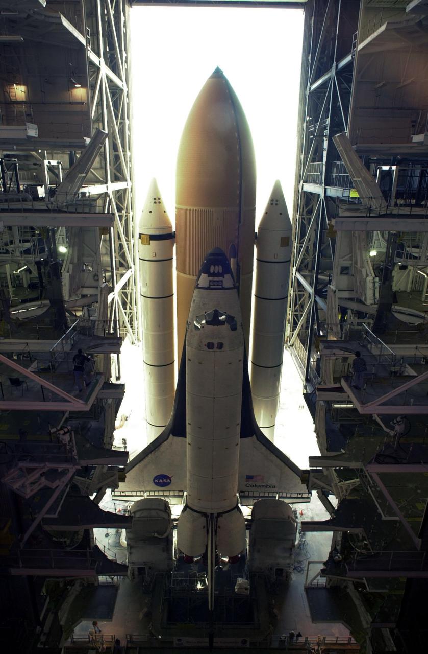 KENNEDY SPACE CENTER, FLA. -- Space Shuttle Columbia sits atop its Mobile Launcher Platform in the open doorway of the Vehicle Assembly Building. The Shuttle never left the VAB due to a steering problem on the crawler-transporter under the MLP. The problem was a faulty bearing in the steering linkage of Power Truck Drive D, which was detected before the C-T left the VAB. Rollout has been rescheduled for Jan. 24