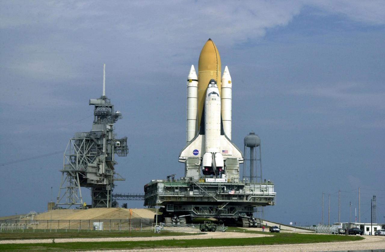 KENNEDY SPACE CENTER, FLA. -- Space Shuttle Columbia, atop its Mobile Launcher Platform, begins the ascent up the incline to Launch Pad 39A. Columbia is scheduled to be launched Feb. 28 on mission STS-109, a Hubble Servicing Mission. The goal of the mission is to replace Solar Array 2 with Solar Array 3, replace the Power Control Unit, remove the Faint Object Camera and install the ACS, install the Near Infrared Camera and Multi-Object Spectrometer (NICMOS) Cooling System, and install New Outer Blanket Layer insulation. The launch will be the first for Columbia after returning from California where it underwent extensive maintenance, inspections and enhancements. More than 100 upgrades make Columbia safer and more reliable than ever before
