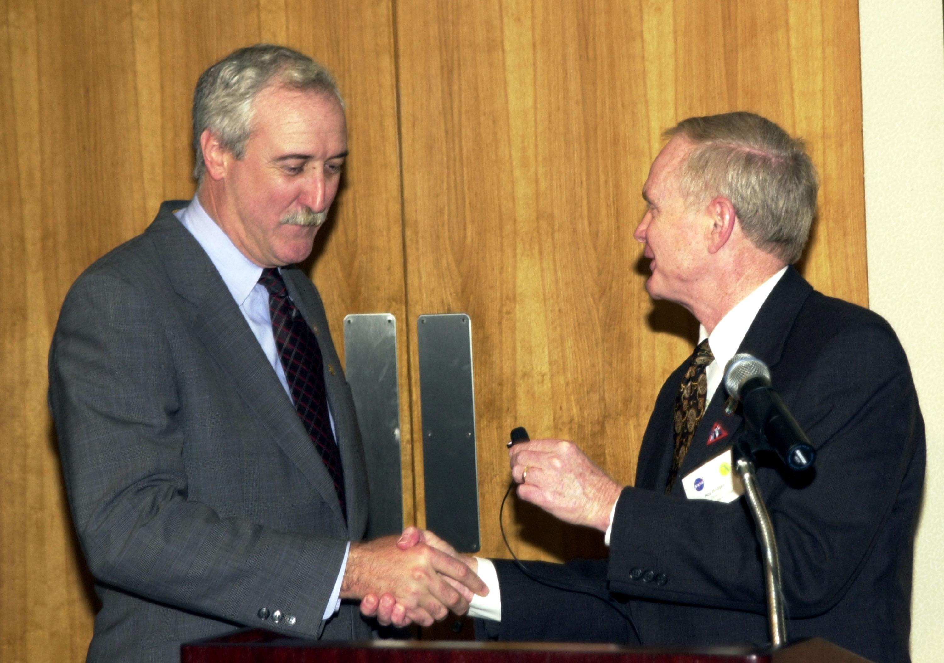 KENNEDY SPACE CENTER, FLA. - Center Director Roy Bridges Jr. (right) introduces the new NASA Administrator Sean O'Keefe at a dinner held in O'Keefe's honor. The administrator was at KSC on an agencywide tour of NASA field centers.  He was nominated for the position as administrator in November 2001 by President George W. Bush.  He was sworn in Dec. 21 as the agency's 10th chief