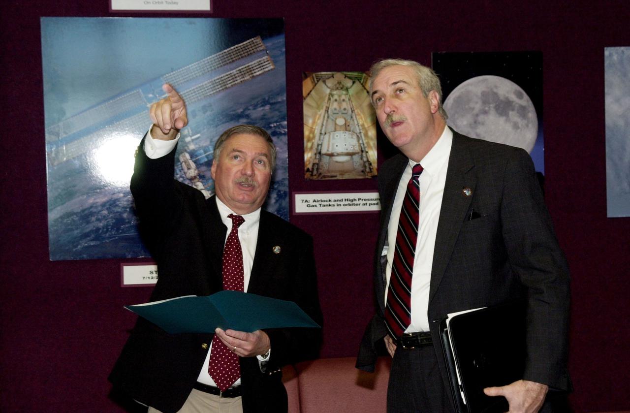 KENNEDY SPACE CENTER, Fla. -  Director of International Space Station_Payload Processing Tip Talone (left) informs the new NASA Administrator Sean O'Keefe (at right) about the elements of the Space Station in the Space Station Processing Facility.  The administrator was at KSC on an agencywide familiarization tour of NASA field centers.  He was nominated for the position as administrator in November 2001 by President George W. Bush.  He was sworn in Dec. 21 as the agency's 10th chief