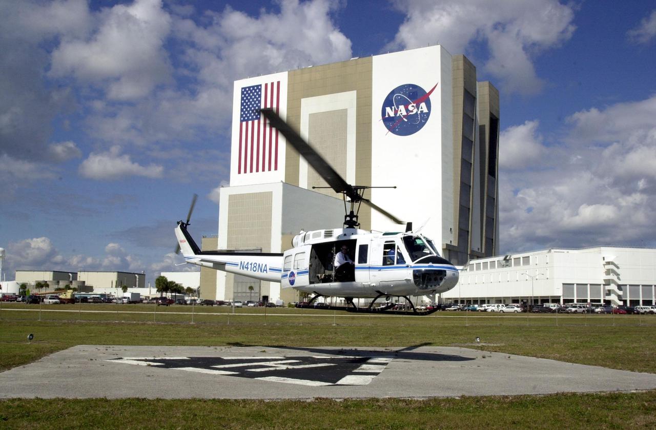 KENNEDY SPACE CENTER, Fla. - A NASA helicopter lifts off, near the Vehicle Assembly Building, carrying the  new NASA Administrator Sean O'Keefe and others for an aerial tour of KSC.    The administrator was at KSC on an agencywide familiarization tour of NASA field centers.  He was nominated for the position as administrator in November 2001 by President George W. Bush.  He was sworn in Dec. 21 as the agency's 10th chief
