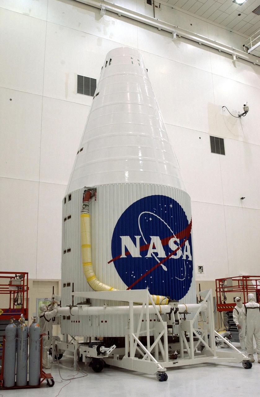 KENNEDY SPACE CENTER, FLA. - The fully encapsulated Tracking and Data Relay Satellite-I (TDRS-I) waits in the Spacecraft Assembly and Encapsulation Facility-2 (SAEF-2) for transfer to Cape Canaveral Air Force Station. The second in a new series of telemetry satellites, TDRS-I replenishes the existing on-orbit fleet of six spacecraft. The TDRS System is the primary source of space-to-ground voice, data and telemetry for the Space Shuttle. It also provides communications with the International Space Station and scientific spacecraft in low-Earth orbit such as the Hubble Space Telescope. This new advanced series of satellites will extend the availability of TDRS communications services until about 2017. Launch of TDRS-I is scheduled for March 8 aboard a Lockheed Martin Atlas IIA rocket from Pad 36-A