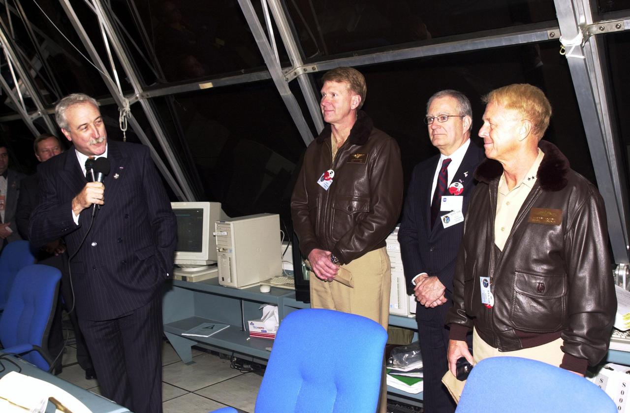 KENNEDY SPACE CENTER, Fla. -  In the firing room, NASA Administrator Sean O'Keefe (left) introduces guests who attended the launch of Space Shuttle Columbia.  Starting in the center, left to right, are Rear Admiral John D. Stufflebeem, U.S. Navy; Lieutenant General Joseph M. Cosumano Jr., US. Army; and Admiral Frank L. Bowman, U.S. Navy.  Liftoff occurred at 6:22:02:08 a.m. EST (11:22:02:08 GMT).  Columbia is on its 27th flight and the 108th flight of the Shuttle Program.  The goal of the mission is the maintenance and upgrade of the Hubble Space Telescope, to be carried out in five spacewalks.  The crew of STS-109 comprises Commander Scott D. Altman, Pilot Duane G. Carey, Payload Commander John M. Grunsfeld, and Mission Specialists Nancy Jane Currie, Richard M. Linnehan, James H. Newman and Michael J. Massimino.  After an 11-day mission, Columbia is expected to return to Kennedy March 12 about 4:35 a.m. EST (09:35 GMT)