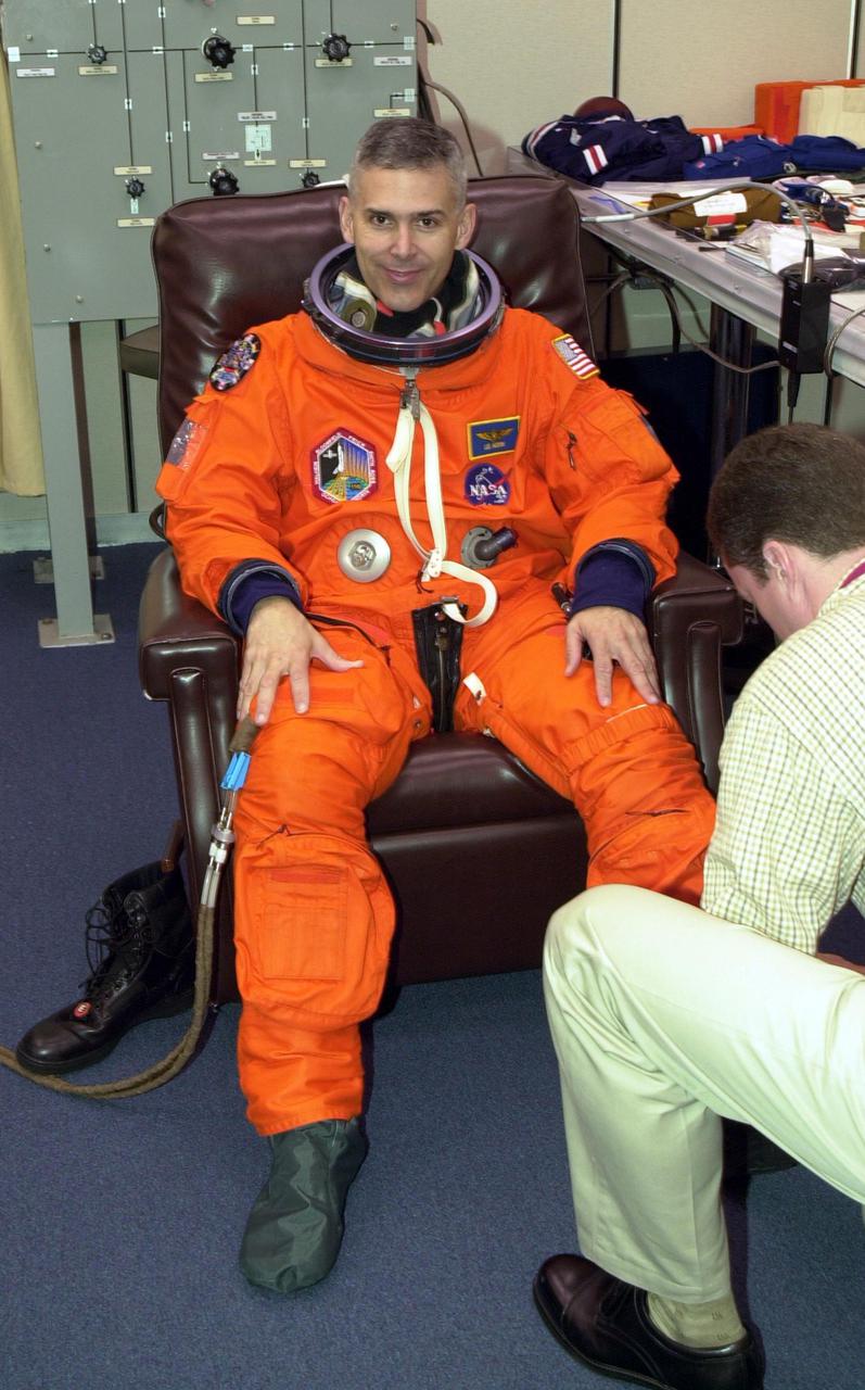 KENNEDY SPACE CENTER, FLA. --  During Terminal Countdown Demonstration Test activities, STS-110 Mission Specialist Lee Morin has his launch and entry suit checked for fit. The TCDT is held at KSC prior to each Space Shuttle flight to provide flight crews an opportunity to participate in simulated launch countdown activities. Scheduled for launch April 4, the 11-day mission will feature Shuttle Atlantis docking with the International Space Station (ISS) and delivering the S0 truss, the centerpiece-segment of the primary truss structure that will eventually extend over 300 feet.