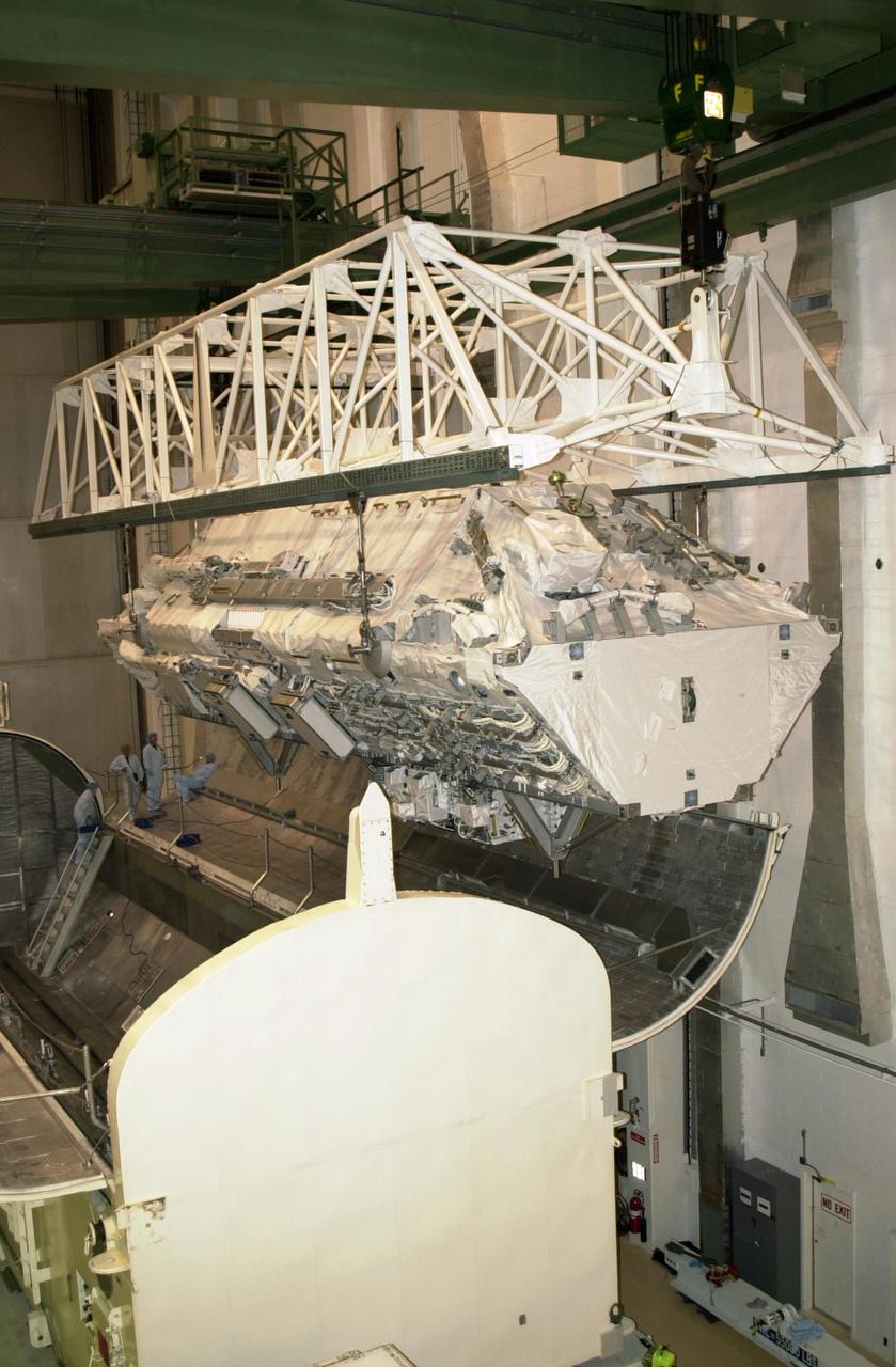 KENNEDY SPACE CENTER, FLA. --  The Integrated Truss Structure S0 arrives at the payload canister in the Operations and Checkout Building for transfer to the launch pad for mission STS-110.  Part of the payload on Space Shuttle Atlantis,  the S0 truss will be attached to the U.S. Lab, 'Destiny,'  on the 11-day mission, becoming the backbone of the orbiting International Space Station (ISS). Launch is scheduled for April 4