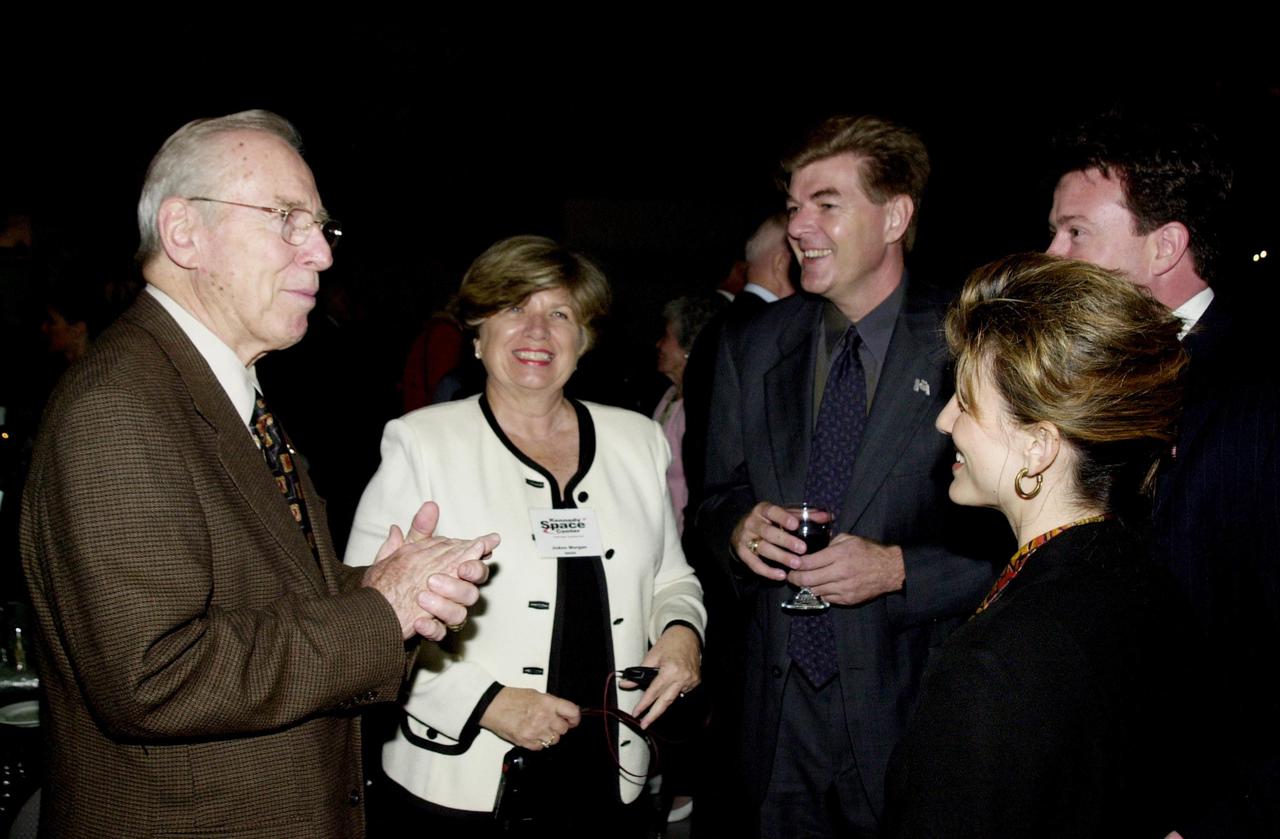 KENNEDY SPACE CENTER, FLA. - The 40th anniversary celebration of American spaceflight was capped with a dinner held at the KSC Apollo_Saturn V Center.  Former astronaut Jim Lovell (left), who hosted the event, talks with JoAnn H. Morgan (next to Lovell) and other guests.  Morgan is director of External Affairs and Business Development at KSC. 