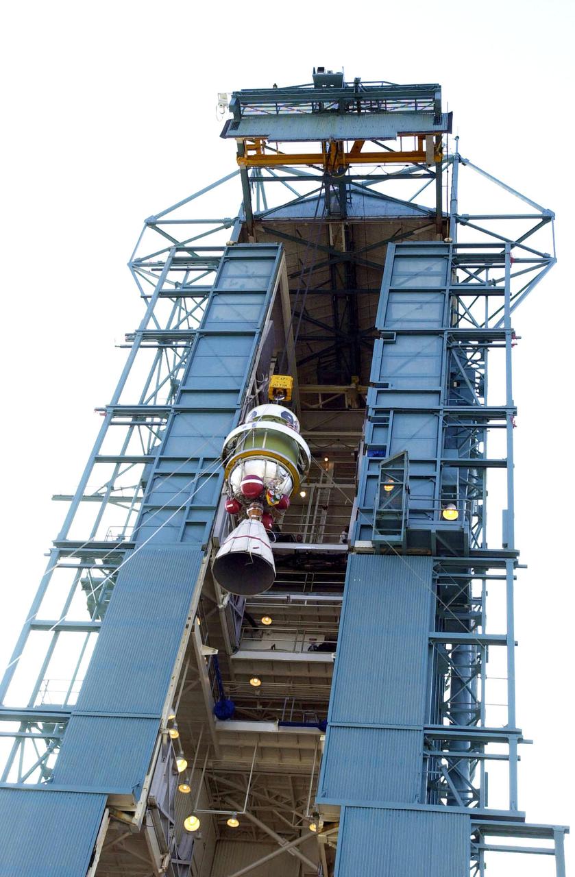 VANDENBERG AFB, CALIF. - The second stage of the Delta II rocket is lifted up the gantry on the launch pad. The Delta II rocket will launch the Aqua-EOS satellite. Aqua is one of a series of spacebased platforms that are central to NASA's Earth Science Enterprise (ESE), a long-term study of the scope, dynamics and implications of global change. The Aqua program is composed of Aqua and other spacecraft (including Terra and Aura) and a data distribution system (ESDIS, and Mission Operations Center Implementation Team).  Flying  in an orbit that covers the globe every 16 days, Aqua will provide a six-year chronology of the planet and its processes. Comprehensive measurements  taken by its onboard instruments will allow multidisciplinary teams of scientists and researchers from North and South  America, Asia, Australia and Europe to assess long-term  change, identify its human and natural causes and advance the development of models for long-term forecasting.  Launch is scheduled for April 26 from Vandenberg