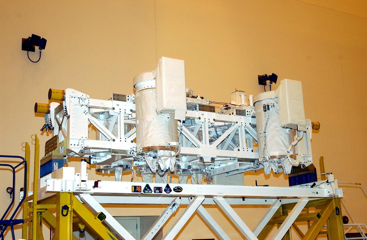 KENNEDY SPACE CENTER, FLA. --  The Hitchhiker Bridge rests on a workstand in the Multi-Payload Processing Facility (MPPF). The bridge is a carrier for the Fast Reaction Experiments Enabling Science, Technology, Applications and Research (FREESTAR) that incorporates eight high priority secondary attached shuttle experiments on mission STS-107.  A research mission, the primary payload is the first flight of the SHI Research Double Module (SHI_RDM), also known as SPACEHAB. The experiments range from material sciences to life sciences.  STS-107 is scheduled to launch July 11, 2002