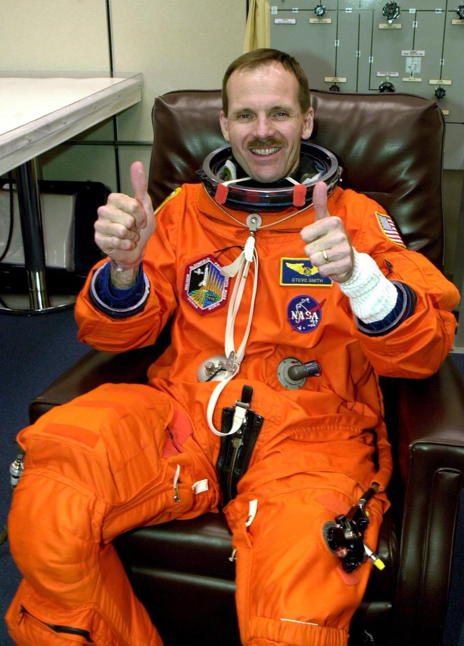KENNEDY SPACE CENTER, FLA. --  Making his fourth Shuttle flight, STS-110 Mission Specialist Steven L. Smith gives a thumbs up for the launch scheduled for 4:40 p.m. EDT. STS-110 is the 13th assembly flight to the International Space Station, carrying the S0 Integrated Truss Structure and Mobile Transporter (MT).  On the 11-day mission, the mission features four spacewalks to attach the S0 truss, which will become the backbone of the Space Station, to the U.S. Lab, 'Destiny.'   The  MT, a space 'railcar,' is attached to the truss segment and will make its debut run during the flight