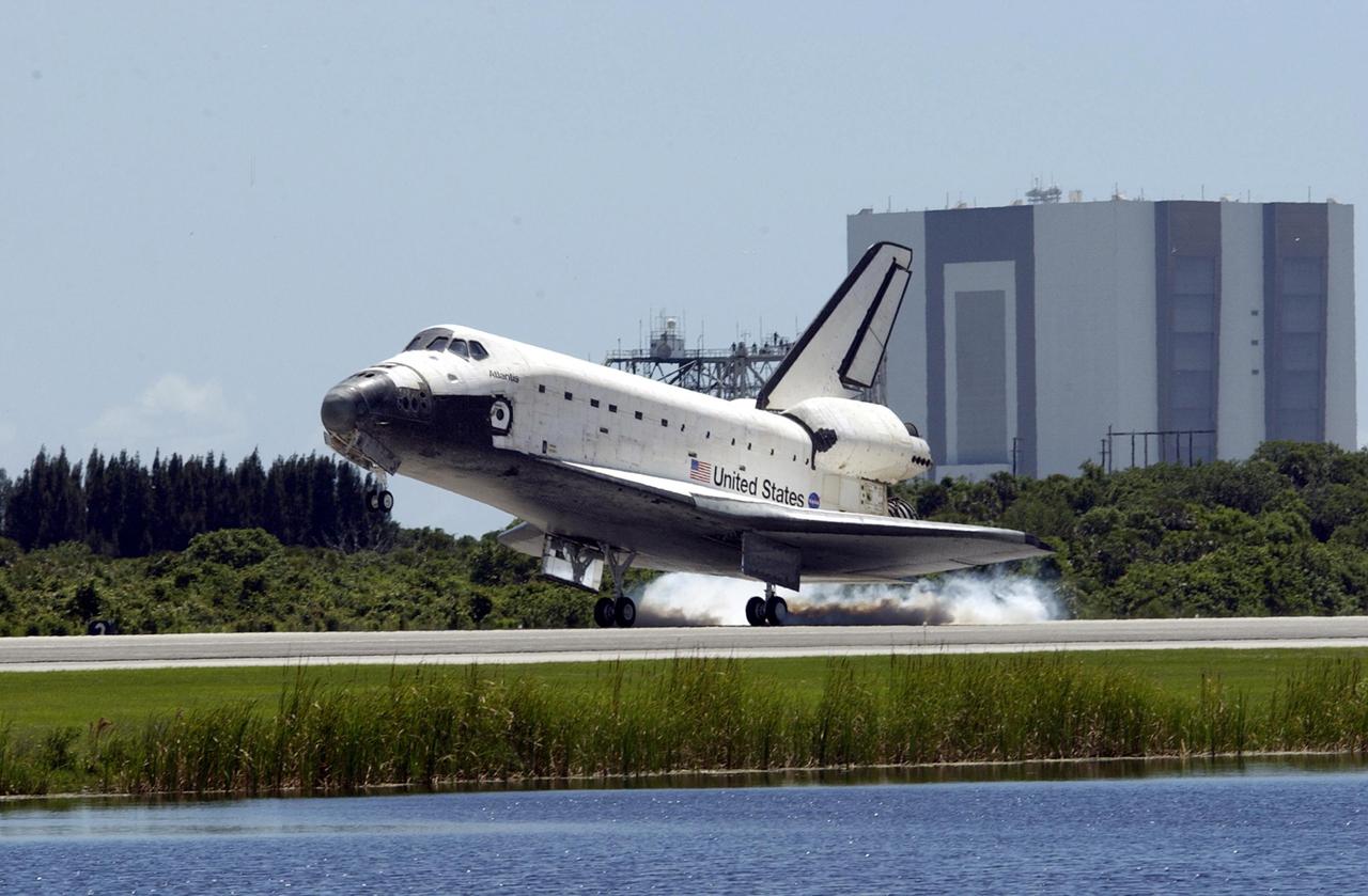 KENNEDY SPACE CENTER, FLA. - Atlantis kicks up dust as its main gear touches down on runway 33 at KSC's Shuttle Landing Facility.  The landing completes the 10-day, 19-hour, 4.5-million mile mission STS-110 to the International Space Station. The orbiter carries the returning crew Commander Michael Bloomfield, Pilot Stephen Frick and Mission Specialists Jerry Ross, Steven Smith, Ellen Ochoa, Lee Morin and Rex Walheim.  Main gear touchdown was 12:26:57 p.m. EDT, nose gear touchdown was 12:27:09 p.m. and wheel stop was 12:28:07 p.m.  The crew delivered and installed the S0 truss, which will support cooling and power systems essential for the addition of future international laboratories, on the Station