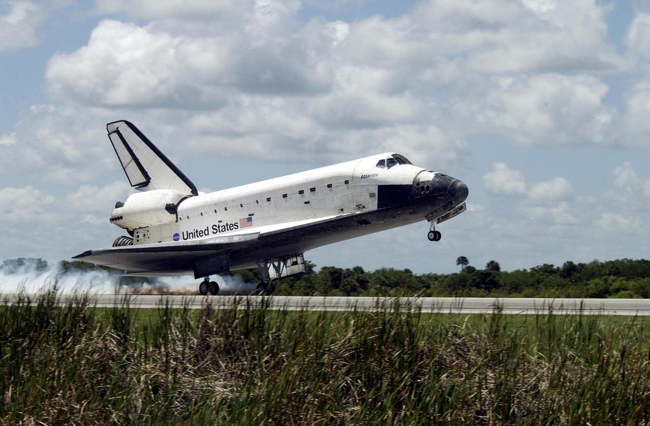 KENNEDY SPACE CENTER, FLA. -- Atlantis kicks up dust as its main gear touches down on runway 33 at KSC's Shuttle Landing Facility.  The landing completes the 10-day, 19-hour, 4.5-million mile mission STS-110 to the International Space Station. The orbiter carries the returning crew Commander Michael Bloomfield, Pilot Stephen Frick and Mission Specialists Jerry Ross, Steven Smith, Ellen Ochoa, Lee Morin and Rex Walheim.  Main gear touchdown was 12:26:57 p.m. EDT, nose gear touchdown was 12:27:09 p.m. and wheel stop was 12:28:07 p.m.  The crew delivered and installed the S0 truss, which will support cooling and power systems essential for the addition of future international laboratories, on the Station