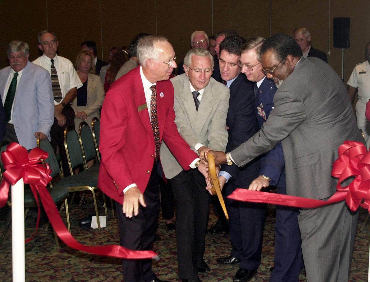 KENNEDY SPACE CENTER, FLA. --  A ribbon cutting kicks off  the opening of the 39th Space Congress in Cape Canaveral, Fla.  From left are Space Congress Chairman Walter Yager, Mayor Rocky Randles of Cape Canaveral,  U.S. Rep. David Weldon, Brig. Gen. Donald P. Pettit, commander of the 45th Space Wing, and KSC Deputy Director Jim Jennings.   This year's theme is 'Beginning a New Era-Initiatives in Space.