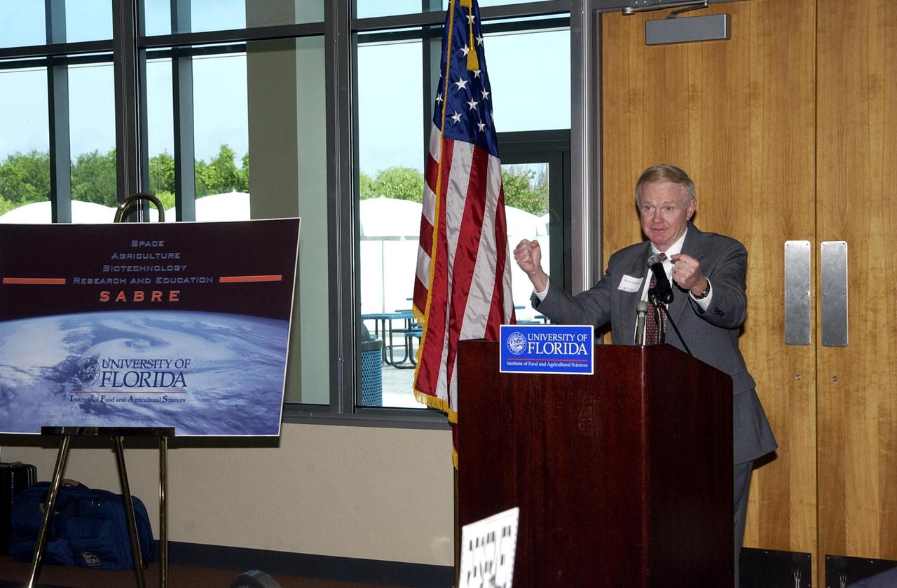KENNEDY SPACE CENTER, FLA. - Center Director Roy D. Bridges Jr. shows his enthusiasm for the new program SABRE being launched at KSC. SABRE, Space Agricultural Biotechnology Research and Education, involves the University of Florida and NASA.   Bridges was speaking at the opening ceremony that included officials from both organizations. SABRE will focus on the discovery, development and application of the biological aspects of advanced life support strategies. The program will include faculty from UF's Institute of Food and Agricultural Sciences, who will be located at both KSC - in the state-owned Space Experiment Research and Processing Laboratory (SERPL) being built there - and UF in Gainesville. SABRE will be directed by Robert Ferl, professor in the horticultural sciences department and assistant director of UF's Biotechnology Program.  He will be responsible for coordinating the research and education efforts of UF and NASA