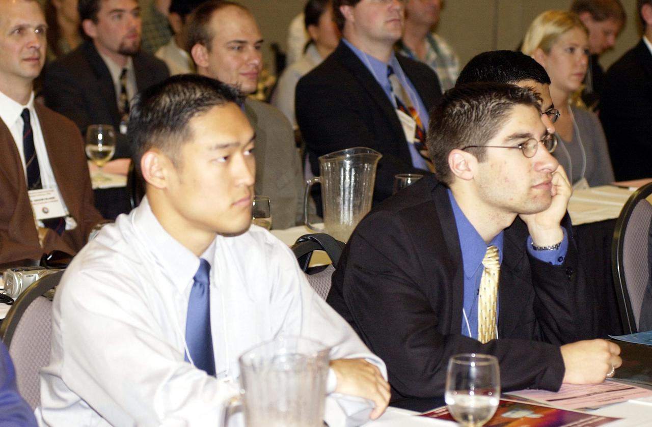 KENNEDY SPACE CENTER, FLA. --  Students listen to remarks at the opening of this year's NASA MarsPort Engineering Design Student Competition 2002 conference at the KSC Visitor Complex, organized by the Florida Space Grant Consortium. Students and faculty from the nation's universities converged at Kennedy for the MarsPort Competition, presenting papers on engineering trade studies to design optimal configurations for a MarsPort Deployable Greenhouse for operation on the surface of Mars.  Judges in the competition were from KSC, Dynamac Corporation and Florida Institute of Technology.   The winning team's innovative ideas will be used by NASA to evaluate and study other engineering trade concepts.  Also featured at the opening ceremony were Dr. Sam Durrance, FSGC director and former astronaut, and Dr. Gary Stutte, plant scientist, Dynamac Corporation. 