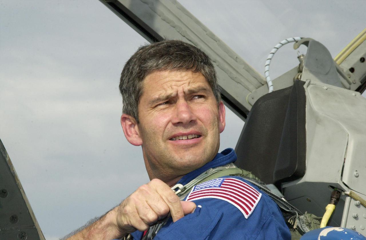 KENNEDY SPACE CENTER, FLA. -- STS-111 Pilot Paul Lockhart arrives at KSC aboard a T-38 jet aircraft to take part in Terminal Countdown Demonstration Test (TCDT) activities, along with the Expedition 5 crew, for launch of mission STS-111.  Expedition 5 will travel on Space Shuttle Endeavour to the International Space Station as a replacement crew for Expedition 4.  The TCDT is a rehearsal for launch and includes emergency egress training, familiarization with payload and a simulated launch countdown.  Mission STS-111 is a utilization flight that will deliver equipment and supplies to the Station.  Along with the Multi-Purpose Logisitics Module Leonardo, the payload includes the Mobile Base System, part of the Canadian Mobile Servicing System, or MSS, and an Orbital Replacement Unit, the replacement wrist_roll joint for the SSRMS (Canadarm2).  Launch of Endeavour is scheduled for May 30, 2002