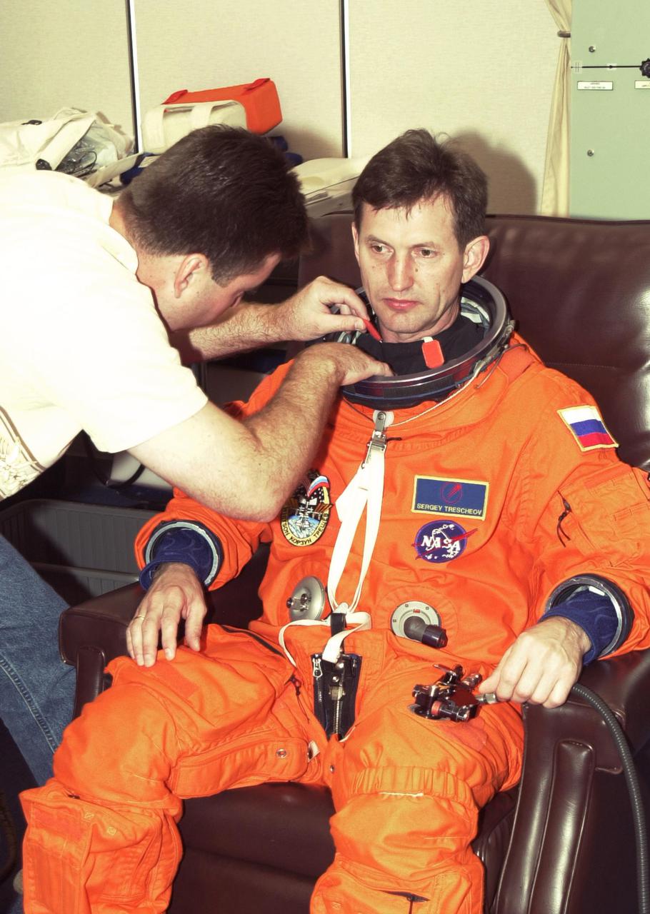 KENNEDY SPACE CENTER, FLA. -- Expedition 5 crew member Sergei Treschev, with the Russian Space Agency, undergoes a suit check as part of Terminal Countdown Demonstration Test activities at KSC. The TCDT includes emergency egress training at the pad and a simulated launch countdown. Expedition 5 will travel to the International Space Station on mission STS-111 as the replacement crew for Expedition 4, who will return to Earth aboard Endeavour. Known as Utilization Flight -2, the mission includes attaching a Canadian-built mobile base system to the International Space Station that will enable the Canadarm2 robotic arm to move along a railway on the Station's truss to build and maintain the outpost. The crew will also replace a faulty wrist_roll joint on the Canadarm2 as well as unload almost three tons of experiments and supplies from the Italian-built Multi-Purpose Logistics Module Leonardo. Launch of Space Shuttle Endeavour on mission STS-111 is scheduled for May 30, 2002