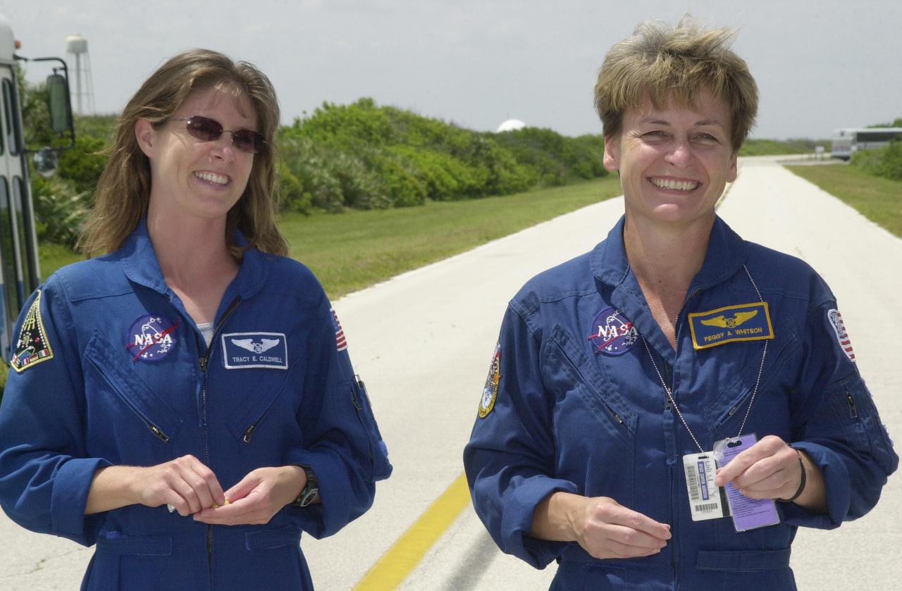 KENNEDY SPACE CENTER, FLA. -- Astronaut Tracy Caldwell (left), a mission specialist candidate currently assigned to the Astronaut Office Space Station Operations Branch, joins Expedition 5 crew member Peggy Whitson (right) during a break in Terminal Countdown Demonstration Test activities at KSC. The TCDT includes emergency egress training at the pad and a simulated launch countdown. Expedition 5 will travel to the International Space Station on mission STS-111 as the replacement crew for Expedition 4, who will return to Earth aboard Endeavour. Known as Utilization Flight -2, the mission includes attaching a Canadian-built mobile base system to the International Space Station that will enable the Canadarm2 robotic arm to move along a railway on the Station's truss to build and maintain the outpost. The crew will also replace a faulty wrist_roll joint on the Canadarm2 as well as unload almost three tons of experiments and supplies from the Italian-built Multi-Purpose Logistics Module Leonardo. Launch of Space Shuttle Endeavour on mission STS-111 is scheduled for May 30, 2002
