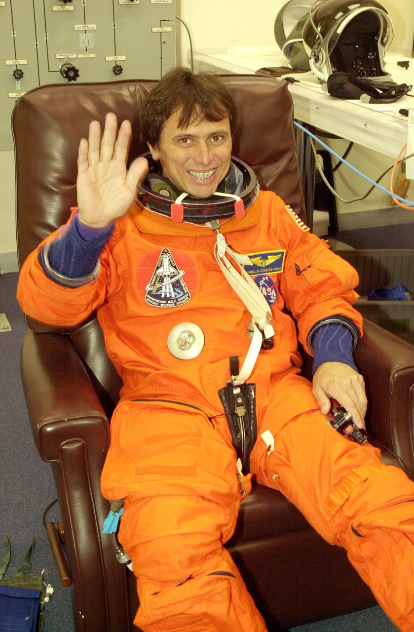 KENNEDY SPACE CENTER, FLA. -- STS-111 Mission Specialist Franklin Chang-Diaz waves during  suitup, getting ready for a simulated launch countdown at the pad. The simulation is part of STS-111 Terminal Countdown Demonstration Test activities for the crew and Expedition 5. The payload on the mission to the International Space Station includes the Mobile Base System, an Orbital Replacement Unit and Multi-Purpose Logistics Module Leonardo.  The Expedition 5 crew is traveling on Endeavour to replace the Expedition 4 crew on the Station.  Launch of Endeavour is scheduled for May 30, 2002