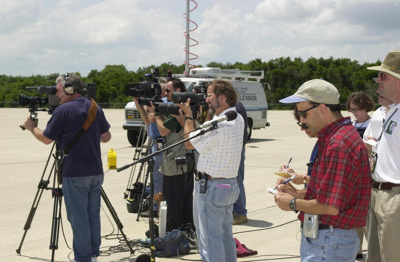 KENNEDY SPACE CENTER, FLA. --  The media photograph and document the words of the departing STS-111 and Expedition 5 crews, who have just completed Terminal Countdown Demonstration Test activities that include emergency egress training and a simulated launch countdown. Expedition 5 will travel to the International Space Station on mission STS-111 as the replacement crew for Expedition 4, who will return to Earth aboard the orbiter. Mission STS-111 is known as Utilization Flight 2, carrying supplies and equipment in the Multi-Purpose Logistics Module Leonardo to the International Space Station.  The payload also includes the Mobile Base System, which will be installed on the Mobile Transporter to complete the Canadian Mobile Servicing System, or MSS, and a replacement wrist_roll joint for Canadarm 2. The mechanical arm will then have the capability to 'inchworm' from the U.S. Lab Destiny to the MSS and travel along the truss to work sites. Launch is scheduled for May 30, 2002