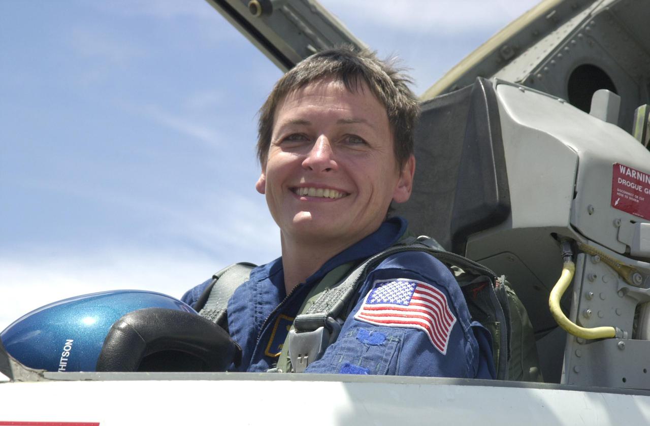 KENNEDY SPACE CENTER, FLA. -- Expedition 5 astronaut Peggy Whitson arrives at KSC aboard a T-38 jet aircraft to prepare for launch on mission STS-111. Expedition 5 will travel to the Station on Space Shuttle Endeavour as the replacement crew for Expedition 4, who will return to Earth aboard the orbiter. Mission STS-111, known as Utilization Flight 2, is carrying supplies and equipment to the International Space Station. The payload includes the Multi-Purpose Logistics Module Leonardo, the Mobile Base System, which will be installed on the Mobile Transporter to complete the Canadian Mobile Servicing System, or MSS, and a replacement wrist_roll joint for Canadarm 2. The mechanical arm will then have the capability to 'inchworm' from the U.S. Lab Destiny to the MSS and travel along the truss to work sites. Launch is scheduled for May 30, 2002