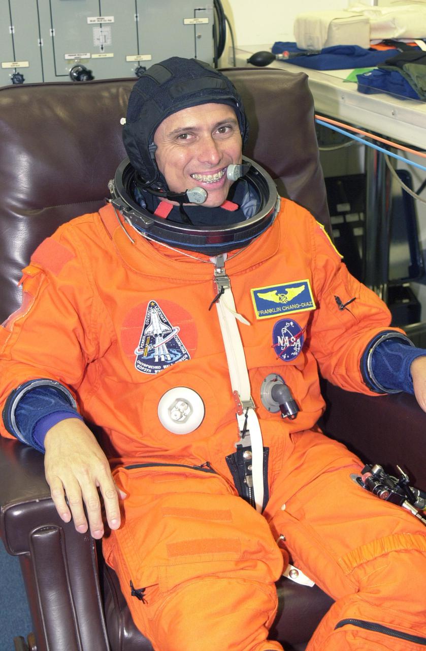 KENNEDY SPACE CENTER, FLA. --  STS-111 Mission Specialist Franklin Chang-Diaz undergoes suit check as part of pre-launch activities.  The mission, known as Utilization Flight 2, is carrying supplies and equipment to the Station. The payload includes the Multi-Purpose Logistics Module Leonardo, the Mobile Base System, which will be installed on the Mobile Transporter to complete the Canadian Mobile Servicing System, or MSS, and a replacement wrist_roll joint for Canadarm 2. The mechanical arm will then have the capability to 'inchworm' from the U.S. Lab Destiny to the MSS and travel along the truss to work sites. Also part of the mission, Expedition 5 will travel to the International Space Station as the replacement crew for Expedition 4, who will return to Earth aboard the orbiter.  Launch is scheduled for May 30, 2002