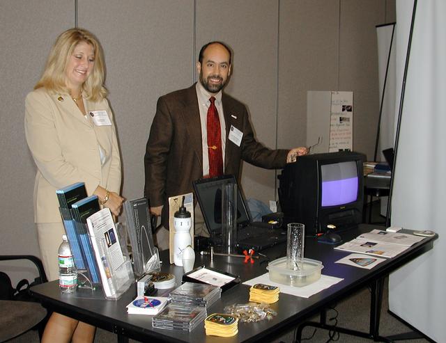 Christi Parker of CST Inc. of Huntsville, AL, and Angel Abbud-Madrid, of the Center for Commercial Applications of Combustion in Space (CCACS) at the Colorado school of Mines, prepare a demonstration of the CCACS Water Mist experiment scheduled to fly on the STS-107 space research mission in 2003. The activity was part of the Space Research and You education event held by NASA's Office of Biological and Physical Research on June 25, 2002, in Arlington, VA, to highlight the research that will be conducted on STS-107. (Digital camera image; no film original.