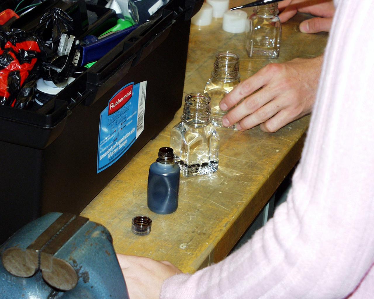 Students prepare to load fluids in their experiment apparatus during the Dropping In a Microgravity Environment (DIME) competition held April 23-25, 2002, at NASA's Glenn Research Center. Competitors included two teams from Sycamore High School, Cincinnati, OH, and one each from Bay High School, Bay Village, OH, and COSI Academy, Columbus, OH. DIME is part of NASA's education and outreach activities. Details are on line at http://microgravity.grc.nasa.gov/DIME_2002.html.