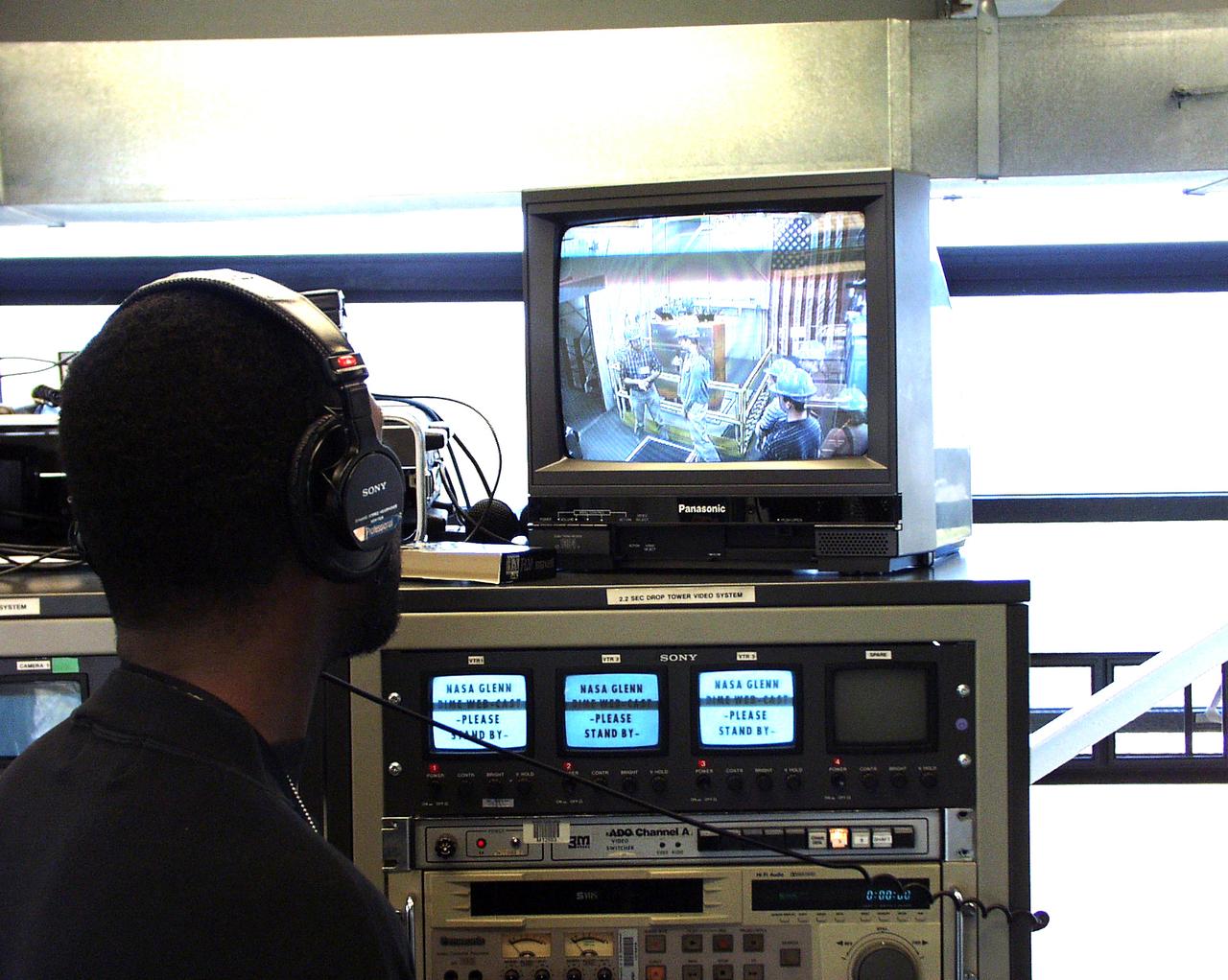 A NASA test conductor at the top of the 2.2-second Drop Tower monitors a student lecture at a lower level. This was part of the Microgravity Environment (DIME) competition held April 23-25, 2002, at NASA's Glenn Research Center. Competitors included two teams from Sycamore High School, Cincinnati, OH, and one each from Bay High School, Bay Village, OH, and COSI Academy, Columbus, OH. DIME is part of NASA's education and outreach activities. Details are on line at http://microgravity.grc.nasa.gov/DIME_2002.html.