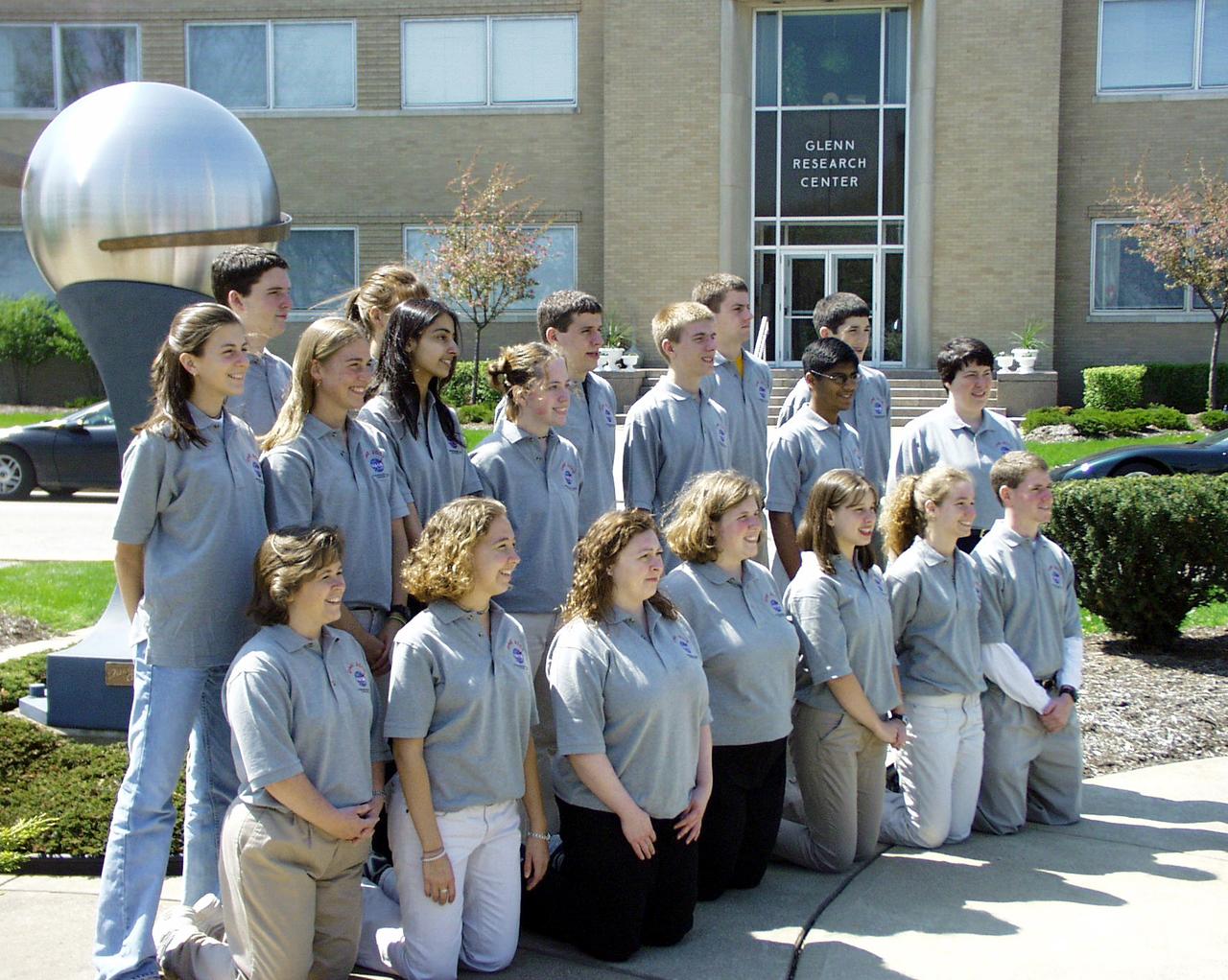 Students from the four teams pose in front of he NASA Glenn Administration Building alongside the NASA Glenn Time Capsule. The students participated in the second Dropping in a Microgravity Environment (DIME) competition held April 23-25, 2002, at NASA's Glenn Research Center. Competitors included two teams from Sycamore High School, Cincinnati, OH, and one each from Bay High School, Bay Village, OH, and COSI Academy, Columbus, OH. DIME is part of NASA's education and outreach activities. Details are on line at http://microgravity.grc.nasa.gov/DIME_2002.html.