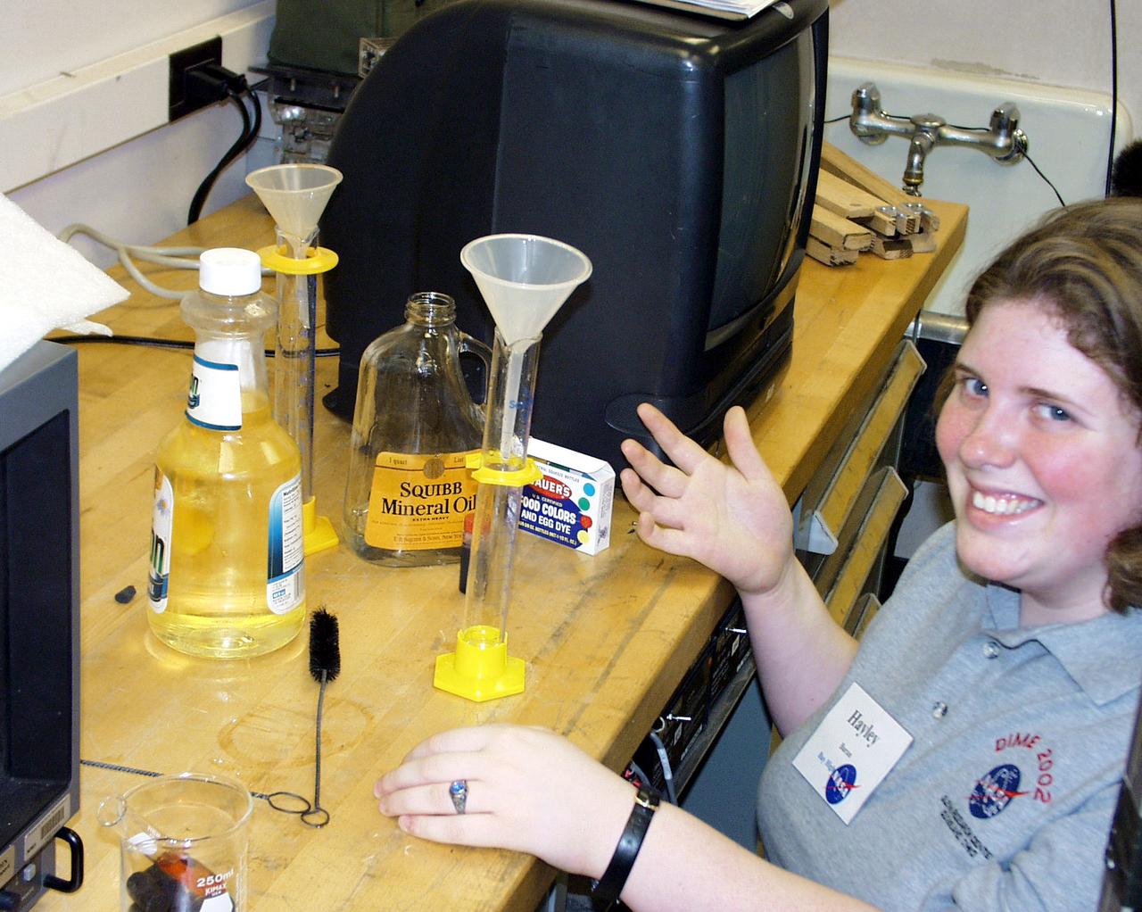 A Bay High School team member prepares the oil and water samples for their next drop operation as part of the second Dropping in a Microgravity Environment (DIME) competition held April 23-25, 2002, at NASA's Glenn Research Center. Competitors included two teams from Sycamore High School, Cincinnati, OH, and one each from Bay High School, Bay Village, OH, and COSI Academy, Columbus, OH. DIME is part of NASA's education and outreach activities. Details are on line at http://microgravity.grc.nasa.gov/DIME_2002.html.