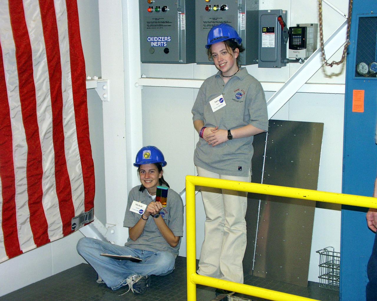 Students pause while waiting their turn at the 2.2-second Drop Tower during the second Dropping in a Microgravity Environment (DIME) competition held April 23-25, 2002, at NASA's Glenn Research Center. Competitors included two teams from Sycamore High School, Cincinnati, OH, and one each from Bay High School, Bay Village, OH, and COSI Academy, Columbus, OH. DIME is part of NASA's education and outreach activities. Details are on line at http://microgravity.grc.nasa.gov/DIME_2002.html.