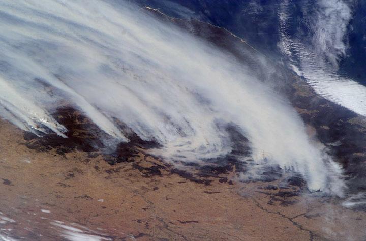 This dramatic image of the Australian brushers was taken from orbit by one of the crew members aboard the International Space Station (ISS). Following the worst regional drought in 50 years, this summer's fire season has resulted in numerous large fires over much of the Great Dividing Range as well as the enormous smoke pall over New South Wales, Victoria, and the adjacent South Pacific Ocean.