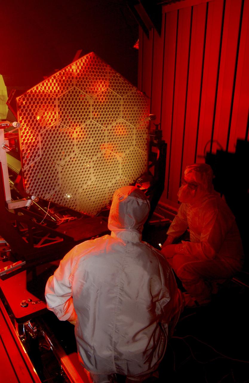 The Eastman-Kodak mirror assembly is being tested for the James Webb Space Telescope (JWST) project at the X-Ray Calibration Facility at Marshall Space Flight Center (MSFC). In this photo, one of many segments of the mirror assembly is being set up inside the 24-ft vacuum chamber where it will undergo x-ray calibration tests. MSFC is supporting Goddard Space Flight Center (GSFC) in developing the JWST by taking numerous measurements to predict its future performance. The tests are conducted in a vacuum chamber cooled to approximate the super cold temperatures found in space. During its 27 years of operation, the facility has performed testing in support of a wide array of projects, including the Hubble Space Telescope (HST), Solar A, Chandra technology development, Chandra High Resolution Mirror Assembly and science instruments, Constellation X-Ray Mission, and Solar X-Ray Imager, currently operating on a Geostationary Operational Environment Satellite. The JWST is NASA's next generation space telescope, a successor to the Hubble Space Telescope, named in honor of NASA's second administrator, James E. Webb. It is scheduled for launch in 2010 aboard an expendable launch vehicle. It will take about 3 months for the spacecraft to reach its destination, an orbit of 940,000 miles in space.