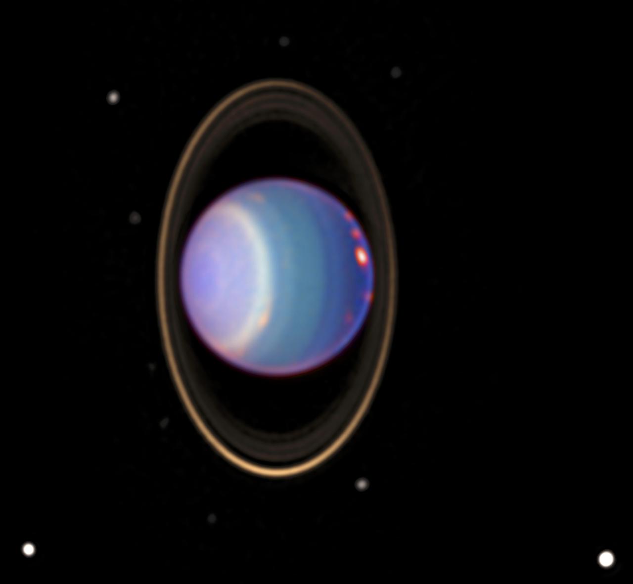 A recent Hubble Space Telescope (HST) view reveals Uranus surrounded by its 4 major rings and 10 of its 17 known satellites. This false color image was generated by Erich Karoschka using data taken with Hubble's Near Infrared Camera and Multi-Object Spectrometer. The HST recently found about 20 clouds. The colors in the image indicate altitude. The green and blue regions show where the atmosphere is clear and can be penetrated by sunlight. In yellow and grey regions, the sunlight reflects from a higher haze or cloud layer. The orange and red colors indicate very high clouds, such as cirrus clouds on Earth.