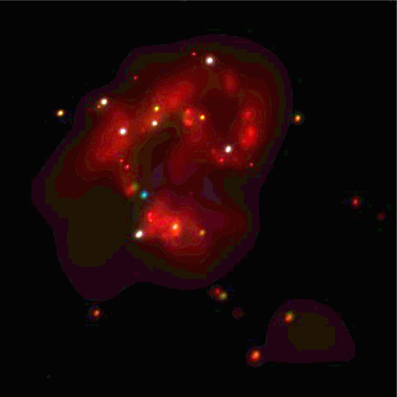 This Chandra image shows the central regions of two colliding galaxies known collectively as the Antennae (NGC-4038/4039). The Chandra image reveals a large population of extremely bright x-ray sources in this area of intense star formation. These x-ray sources, which emit 10 to several hundred times more x-ray power than similar sources in our own galaxy, are believed to be either massive black holes, or black holes that are beaming their energy toward Earth. In this x-ray image, red represents the low energy band, green intermediate, and blue the highest observed energies. The white and yellow sources are those that emit significant amounts of both low and high energy x-rays. About 60 million light years from Earth in the constellation Corvus, the Antennae Galaxies got their nickname from the wispy anntennae-like streams of gas as seen by optical telescopes. These ongoing wisps are believed to have been produced approximately 100 million years ago by the collision between the gala